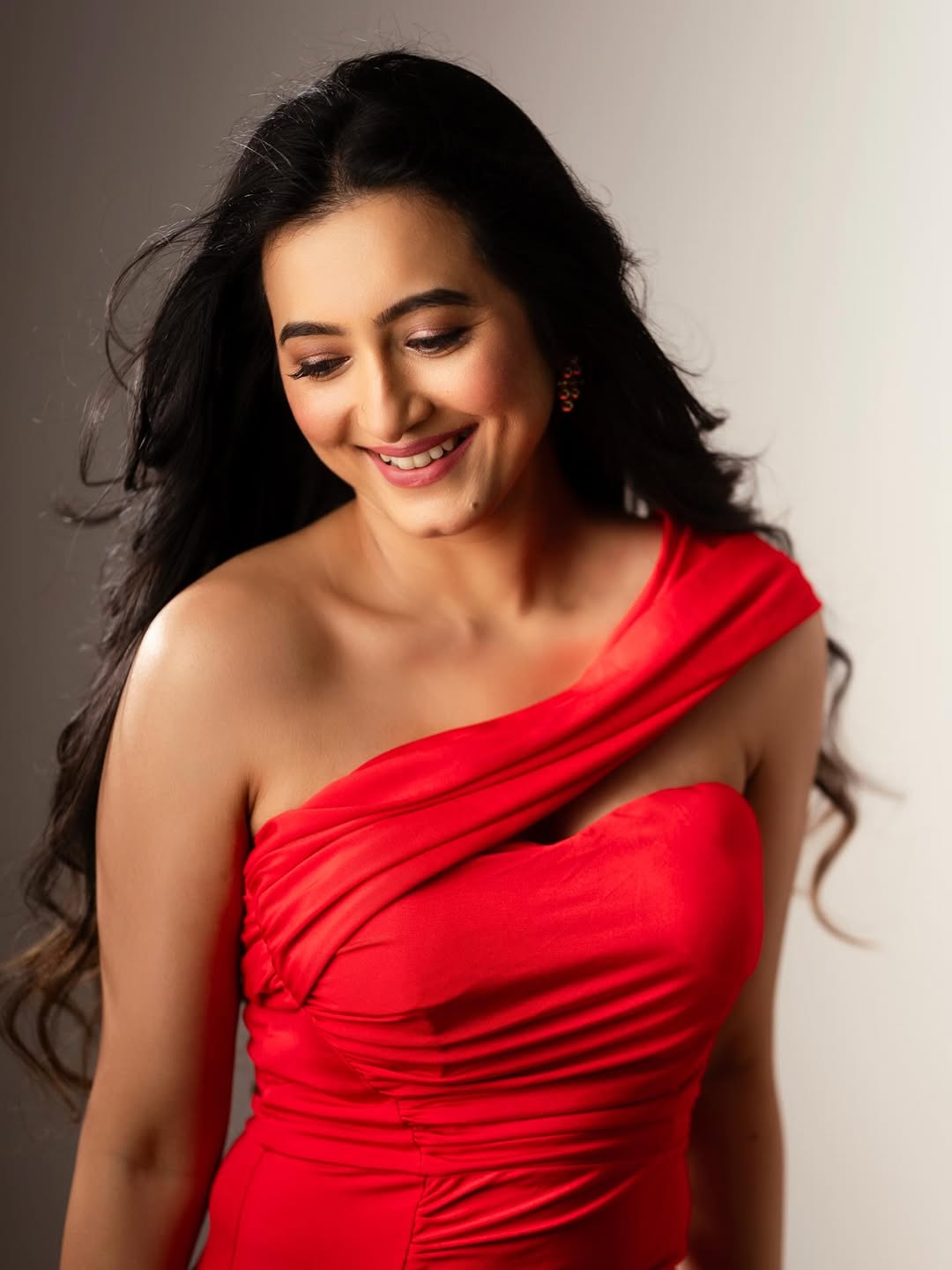 Adhvithi Shetty red dress smiling elegant style