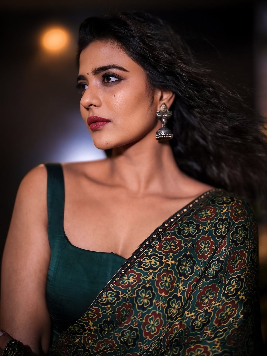 Aishwarya Rajesh in an elegant saree with wind-swept styling and classic glamour