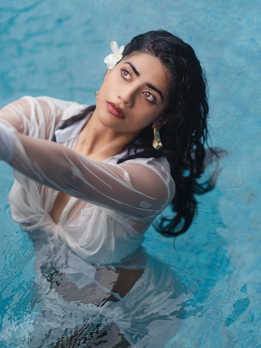 Abhignya Vuthaluru white shirt poolside bold fashion look