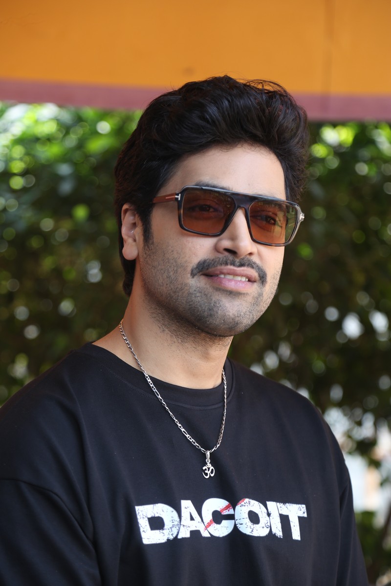Adivi Sesh stylish Dacoit tee with Om pendant