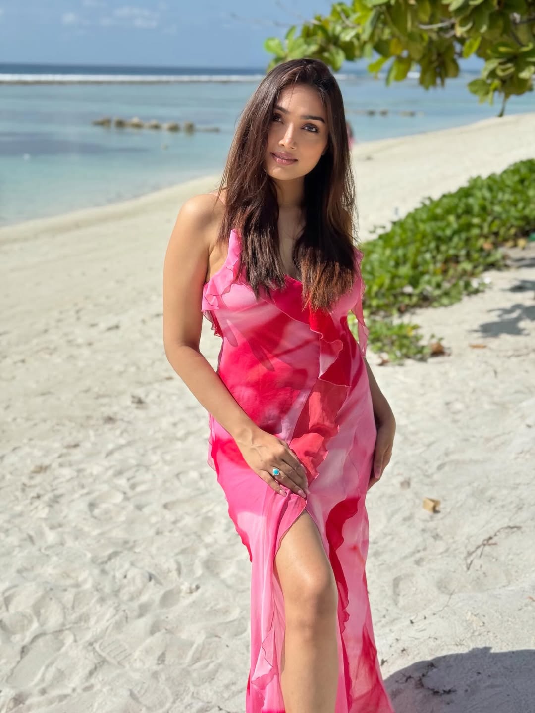Aishwarya Devan vibrant pink outfit beach style