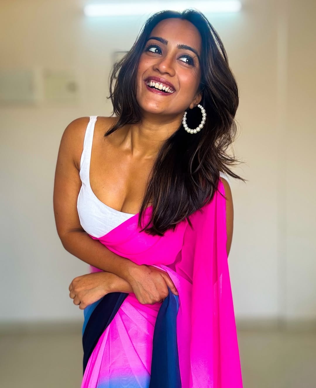 Amika Shail pink outfit pearls elegant statement look