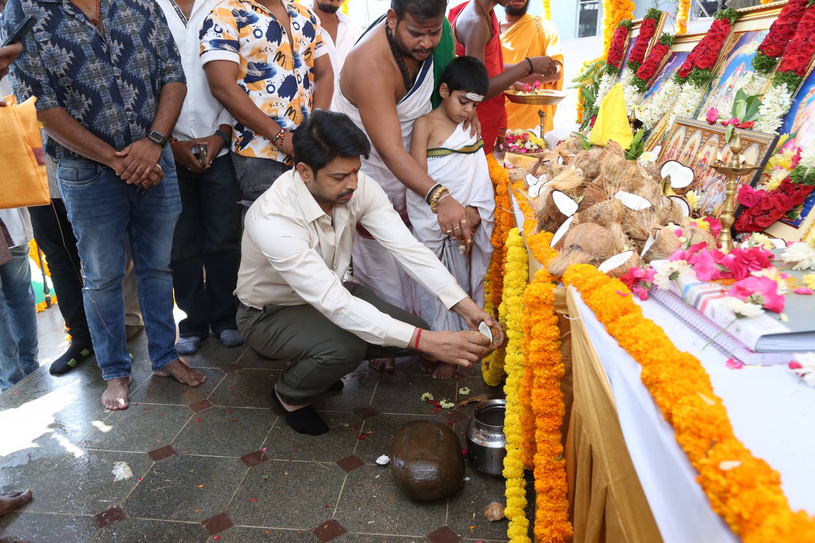 Sriram breaking coconut pooja ceremony