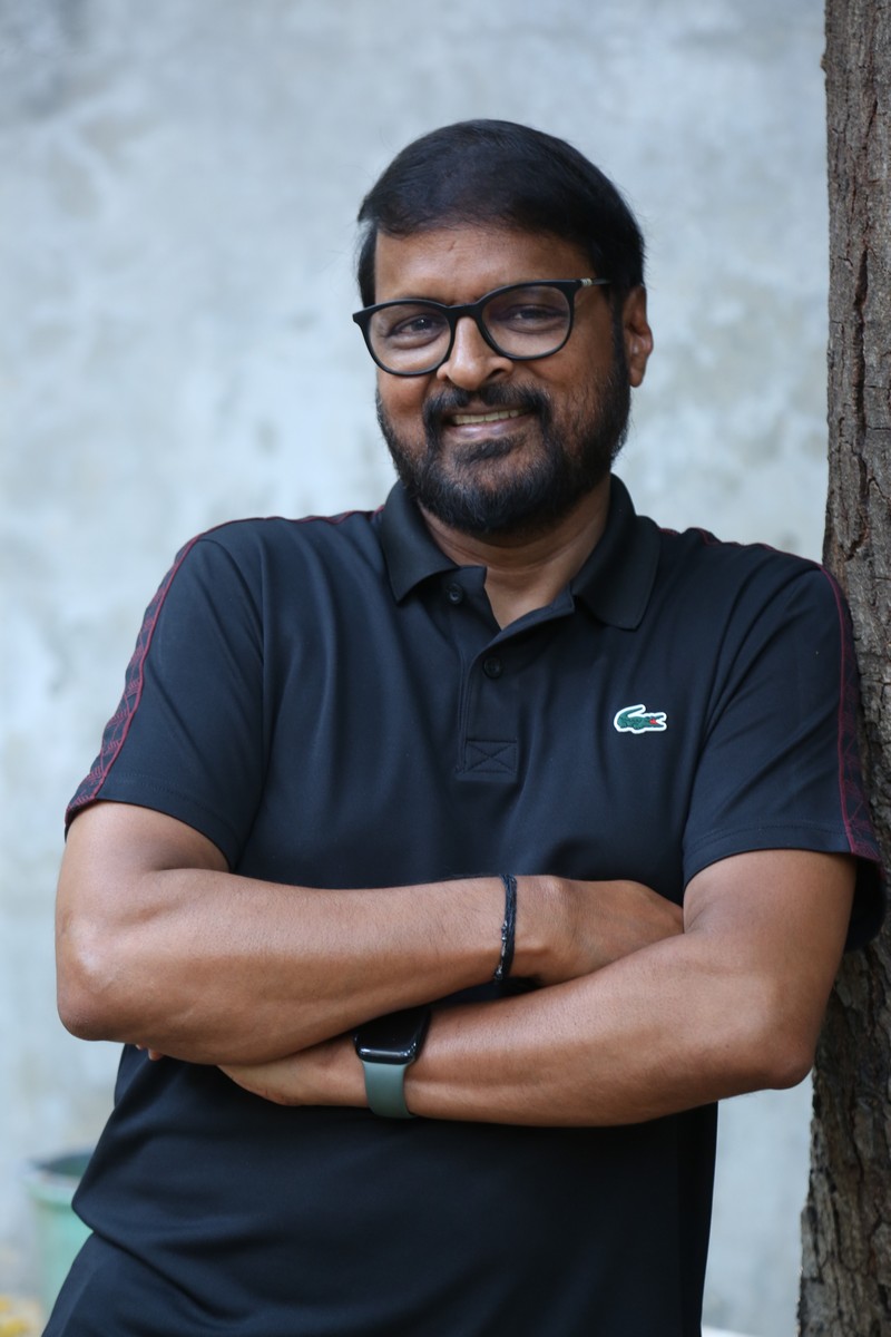 Chiranjeevi Pedamallu Cherry Lacoste polo relaxed confident pose
