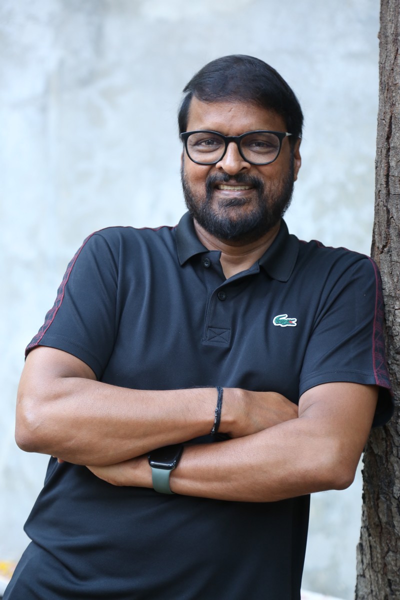 Chiranjeevi Pedamallu Cherry black polo smiling confident look