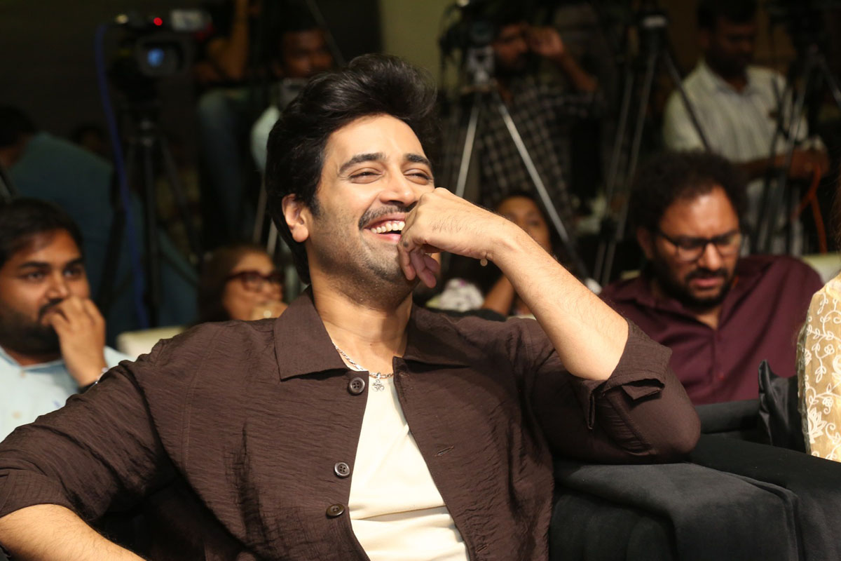 Adivi Sesh laughing seated