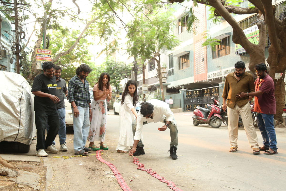 Gedela Raju team celebrating with firecrackers at success event