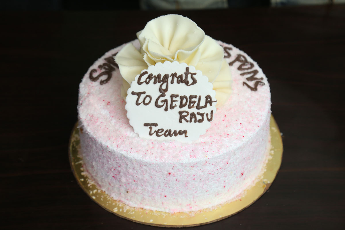 Gedela Raju success celebration cake with congratulatory message