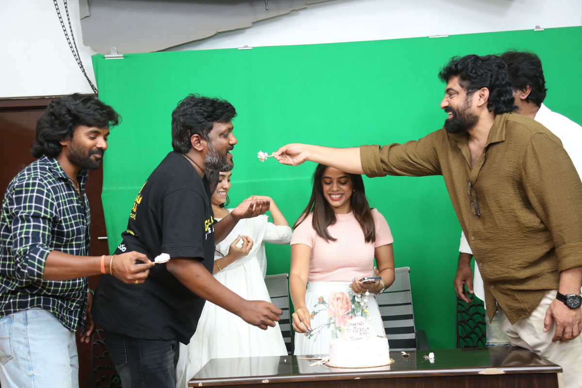 Gedela Raju team feeding cake to each other celebration