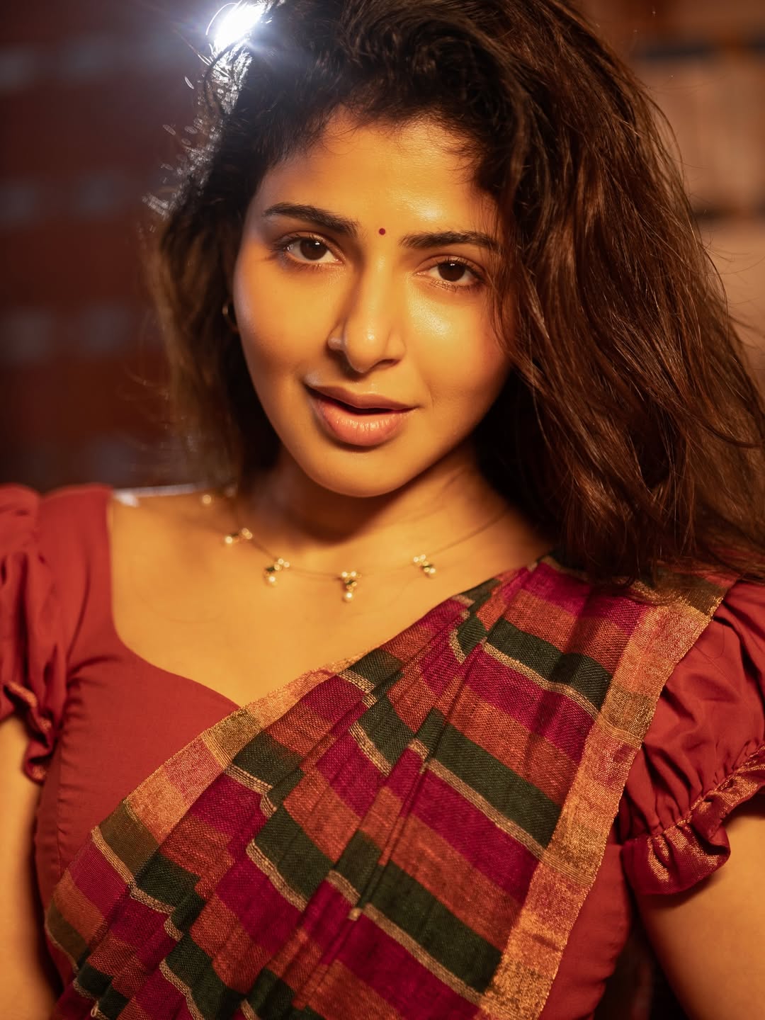 Iswarya Menon elegant pose graceful smile stylish outfit