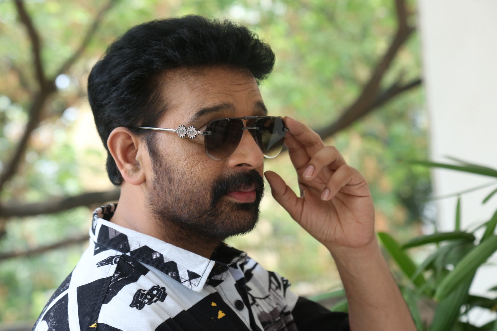 J D Chakravarthy sharp stylish mystery look confident pose