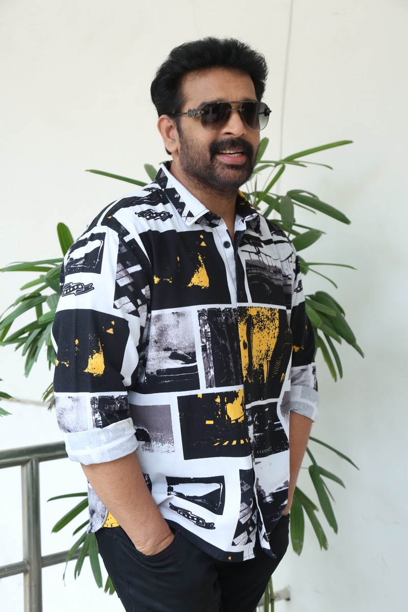 J D Chakravarthy bold printed shirt confident mysterious pose