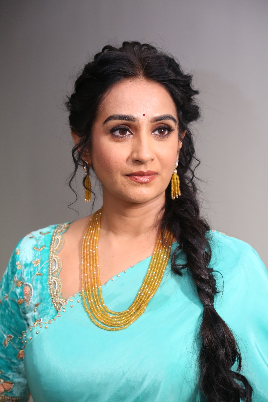 Laya turquoise saree gold jewelry elegant look