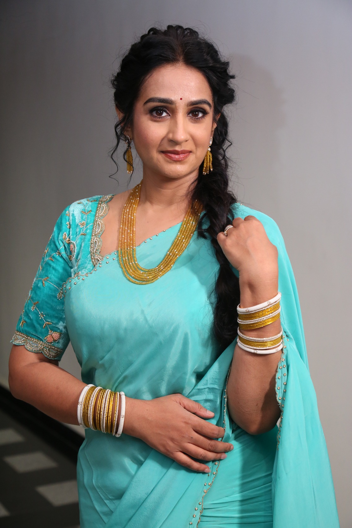 Laya turquoise saree golden accessories elegant style