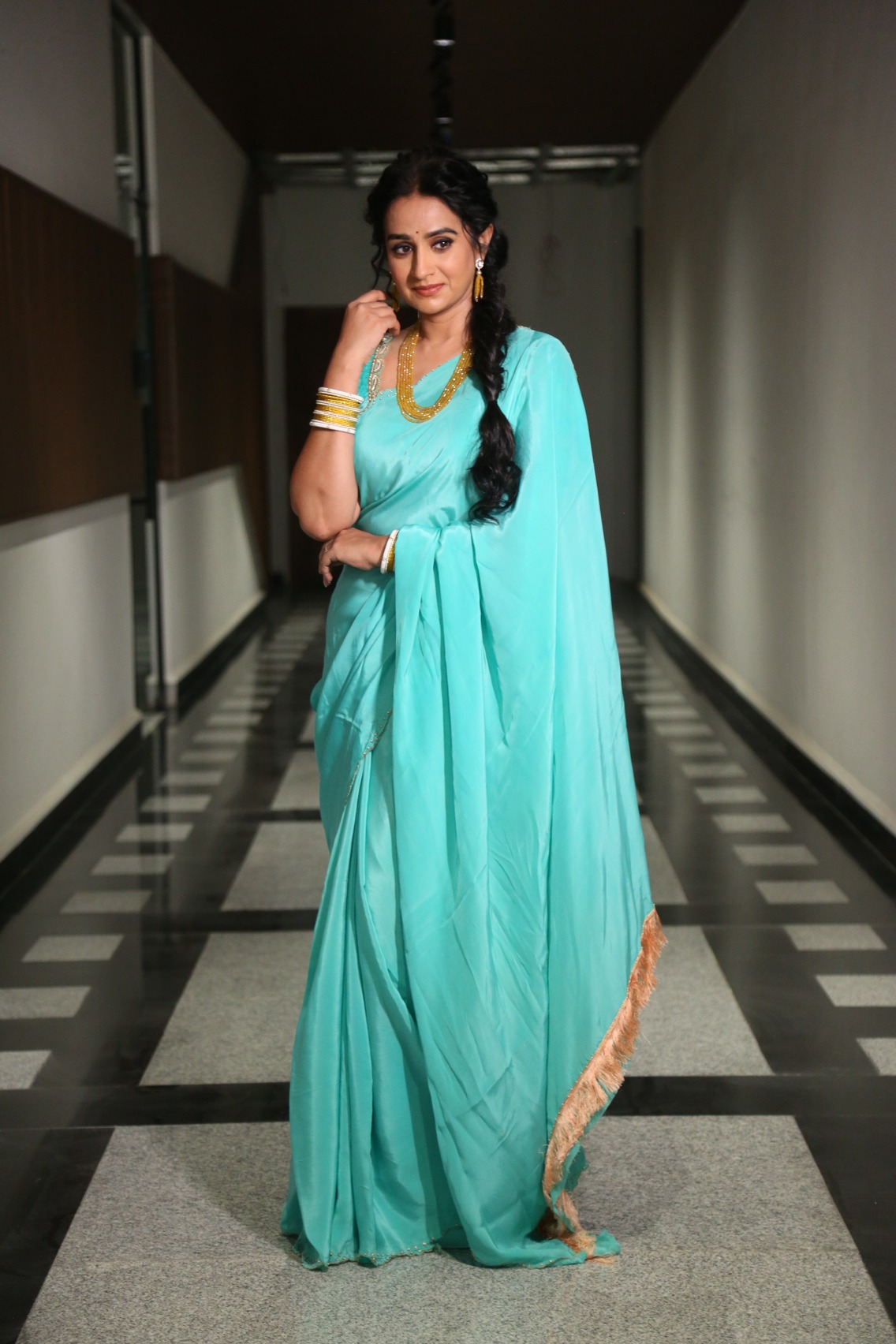 Laya turquoise saree wrapped in elegance look