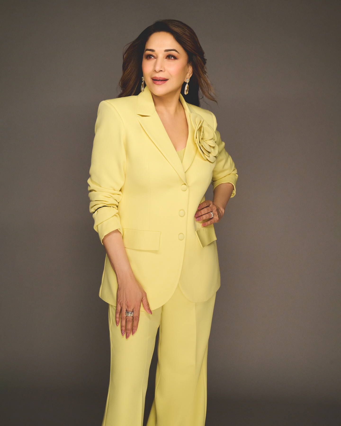 Madhuri Dixit styled in contemporary yellow suit with timeless elegant aura