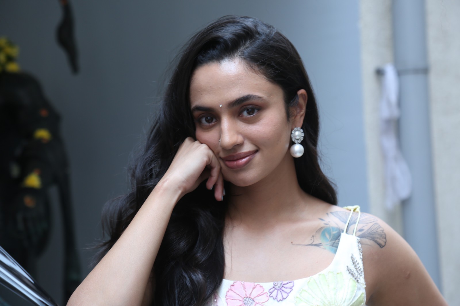 Malvika Nair chic floral dress statement earrings look