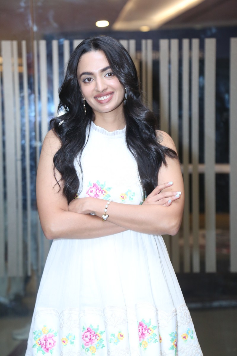 Malvika Nair in dress with cross-stitch inspired patterns and modern styling