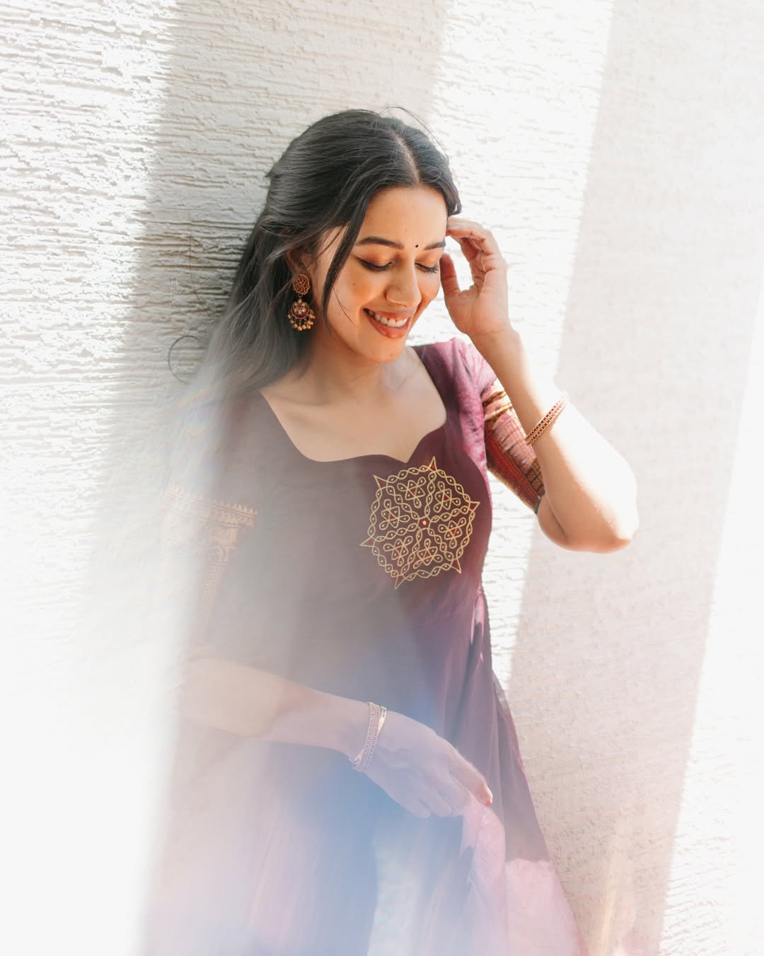 Mirnalini Ravi elegant pose with subtle playful expression