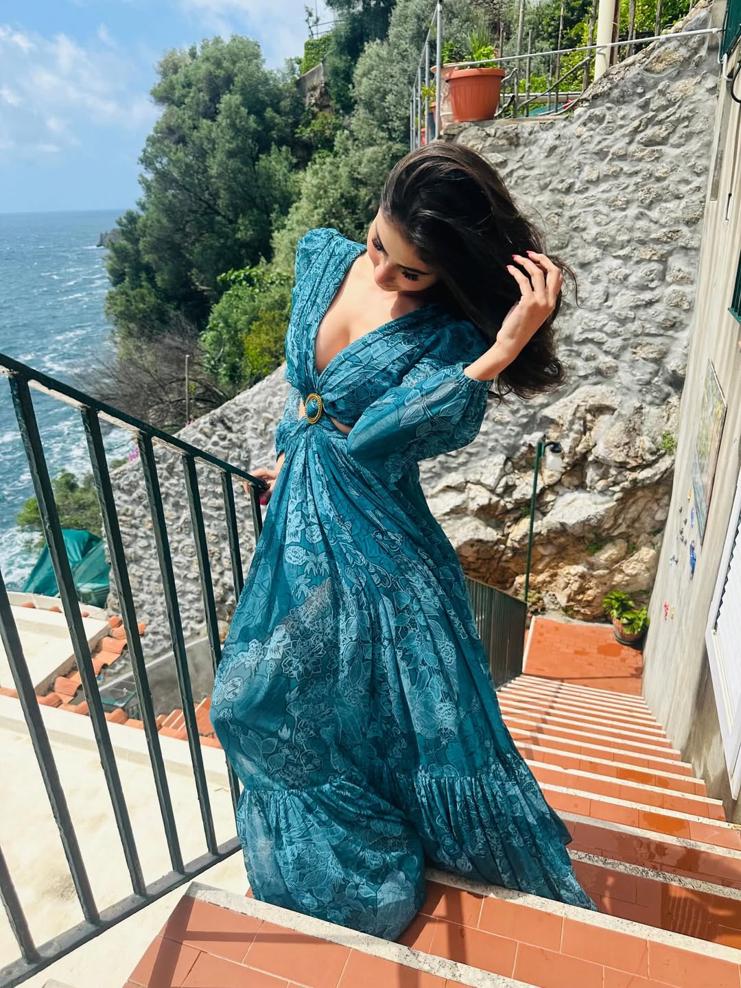 Mouni Roy teal gown seaside steps glamorous look