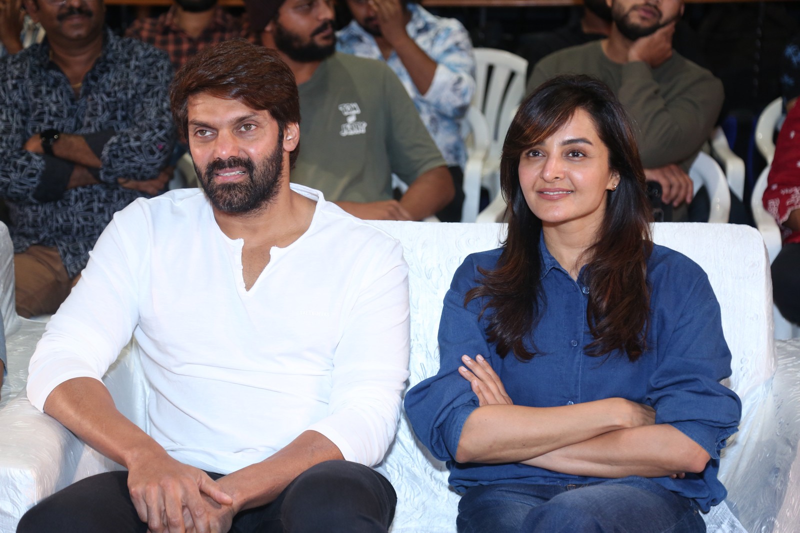 Arya and Manju Warrier seated together at event