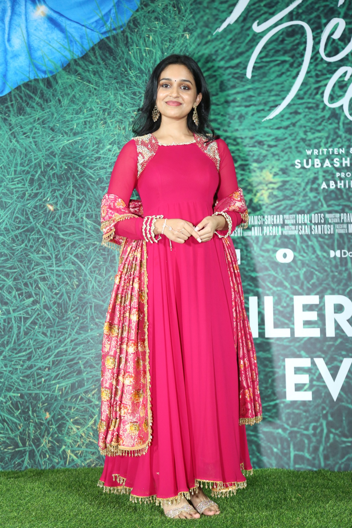 Nidhi Pradeep bold pink dress elegant confident pose