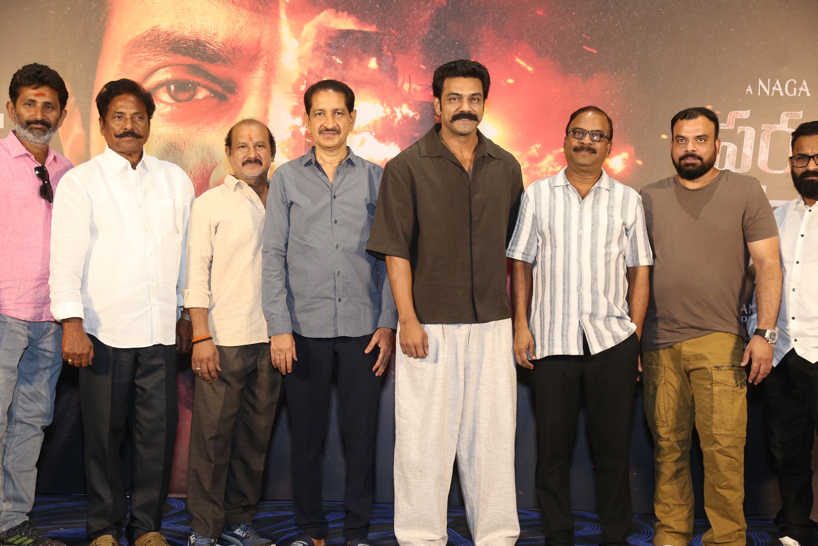 Arjun Ambati with producer and guest posing together