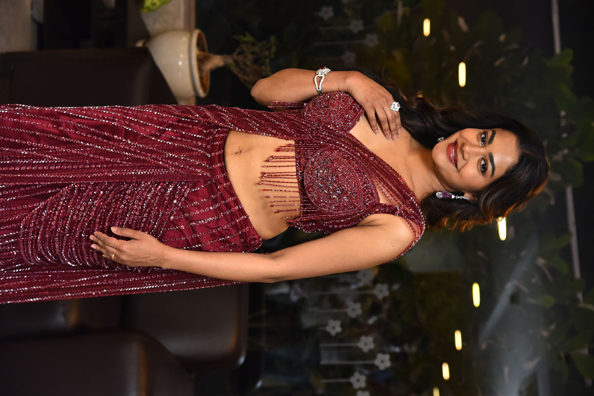 Payal Radhakrishna in stunning red gown with graceful pose
