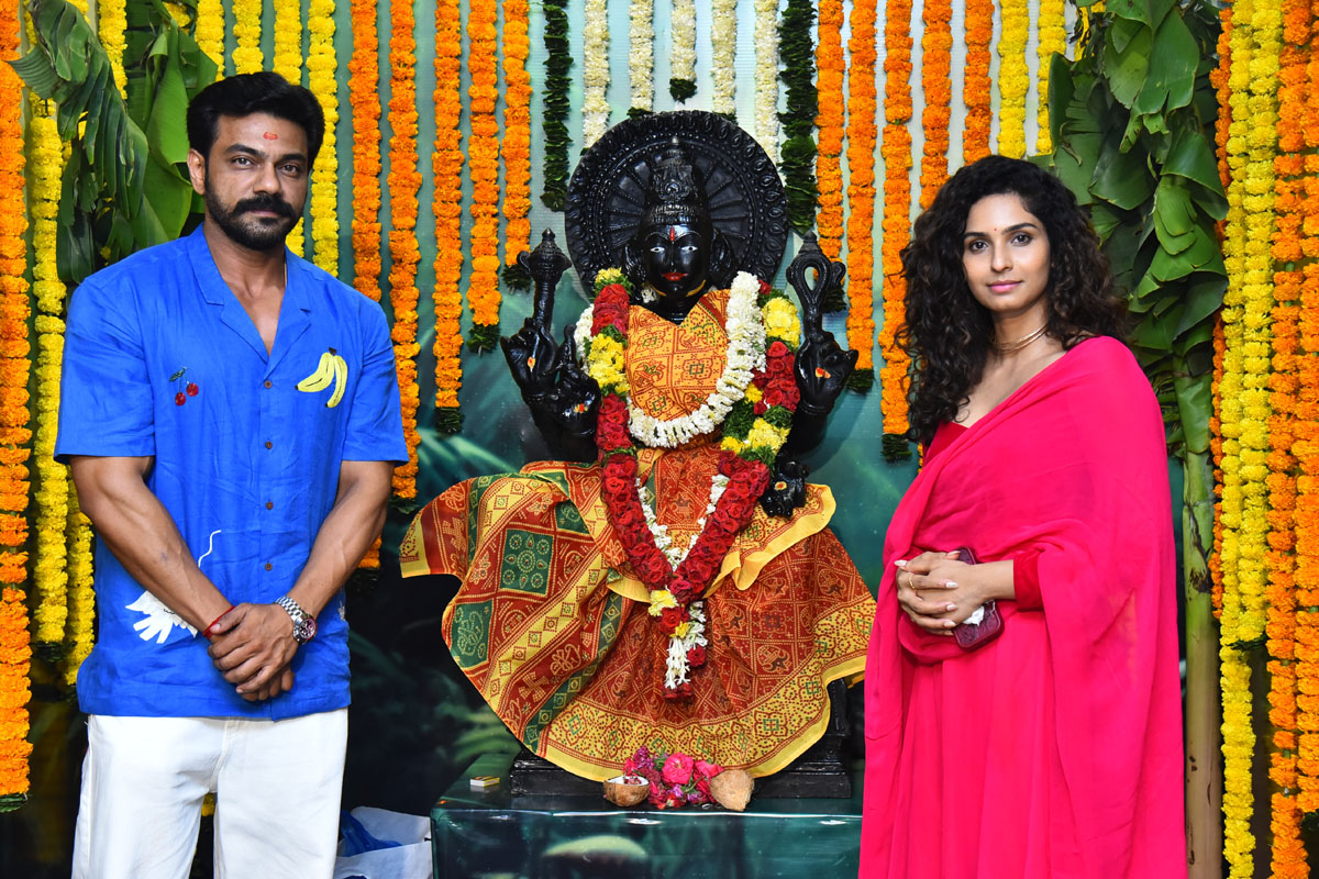 Arjun Ambati Sri Pooja posing with deity