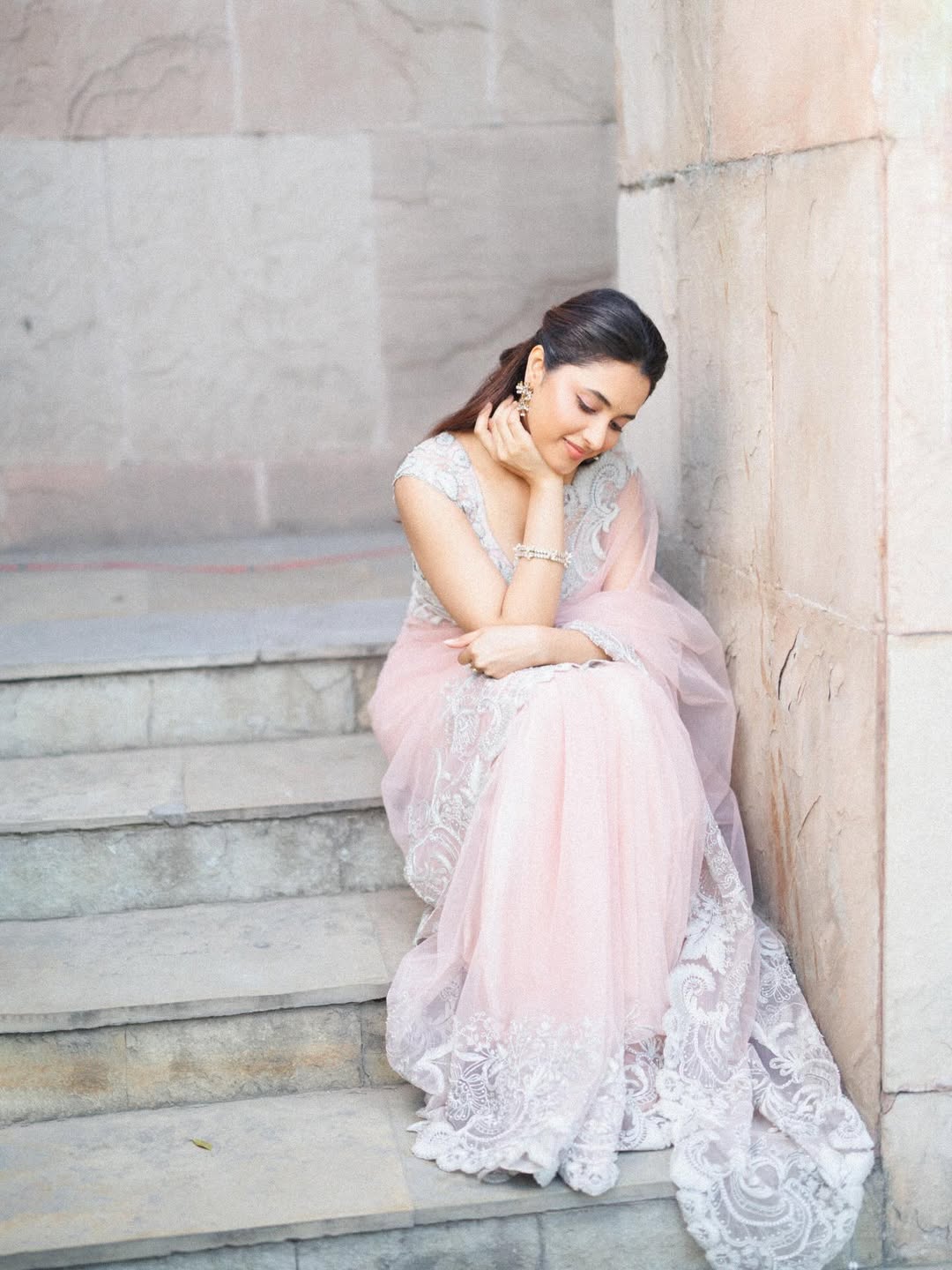Priyanka Mohan gown pose on stairs elegant fashion look