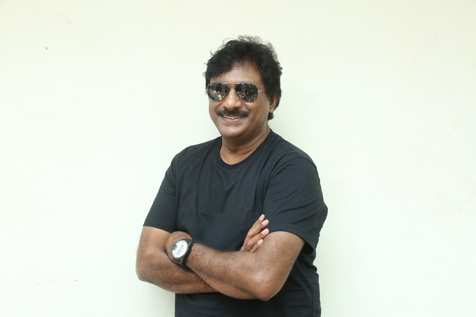 Raghu Kunche stylish professional look with confident pose