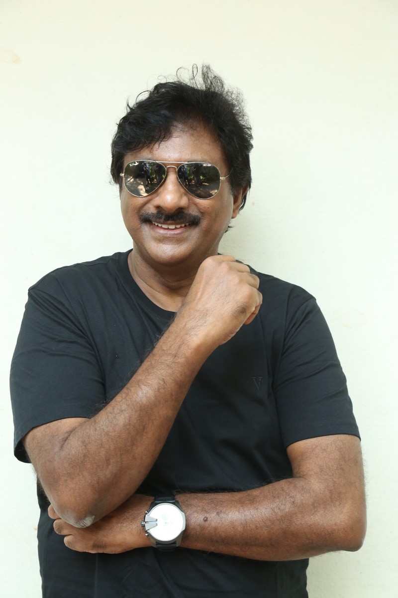 Raghu Kunche black outfit timeless style confident pose
