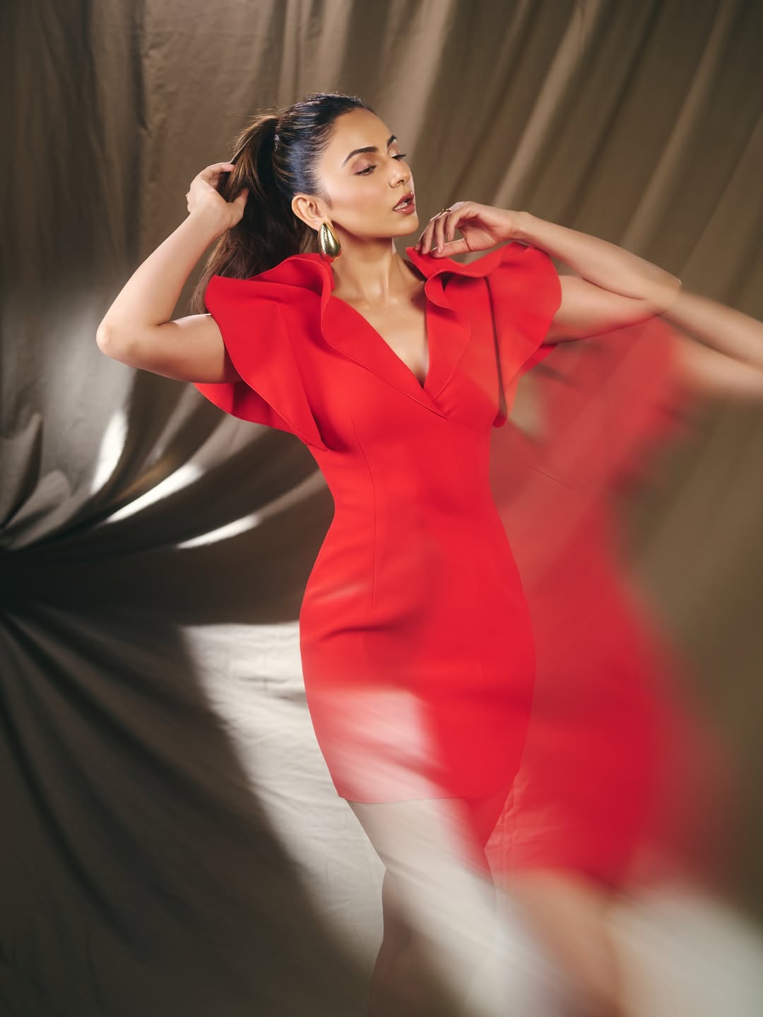 Rakul Preet Singh in red dress with statement shoulders