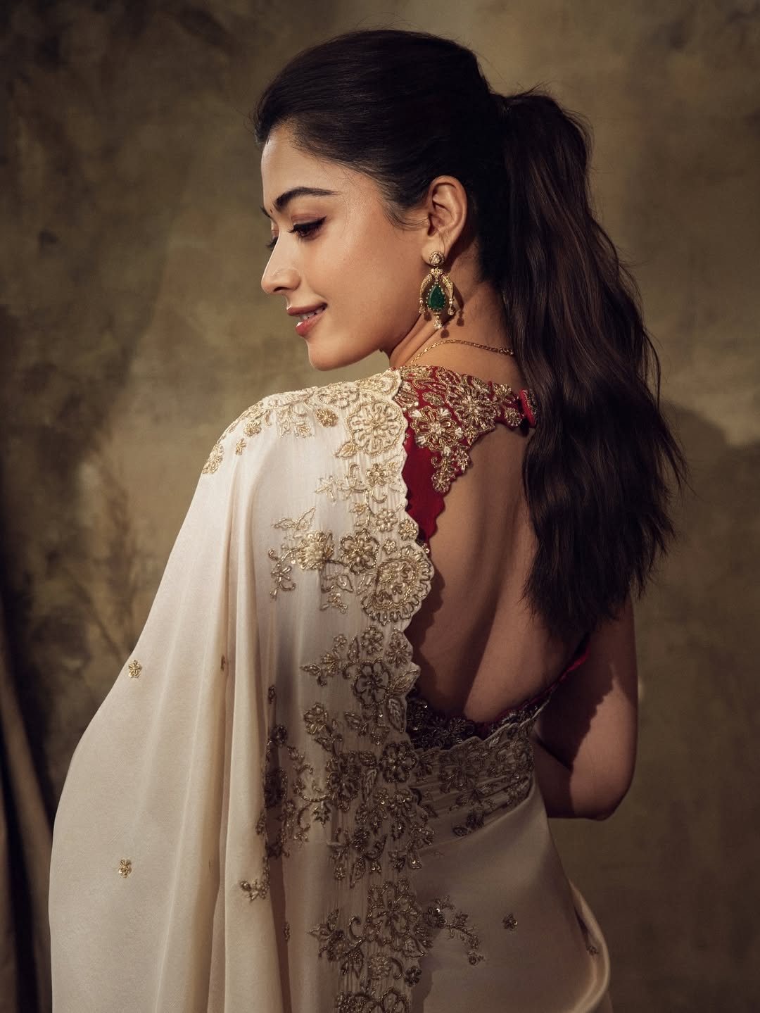 Rashmika Mandanna back pose showcasing stunning saree elegance
