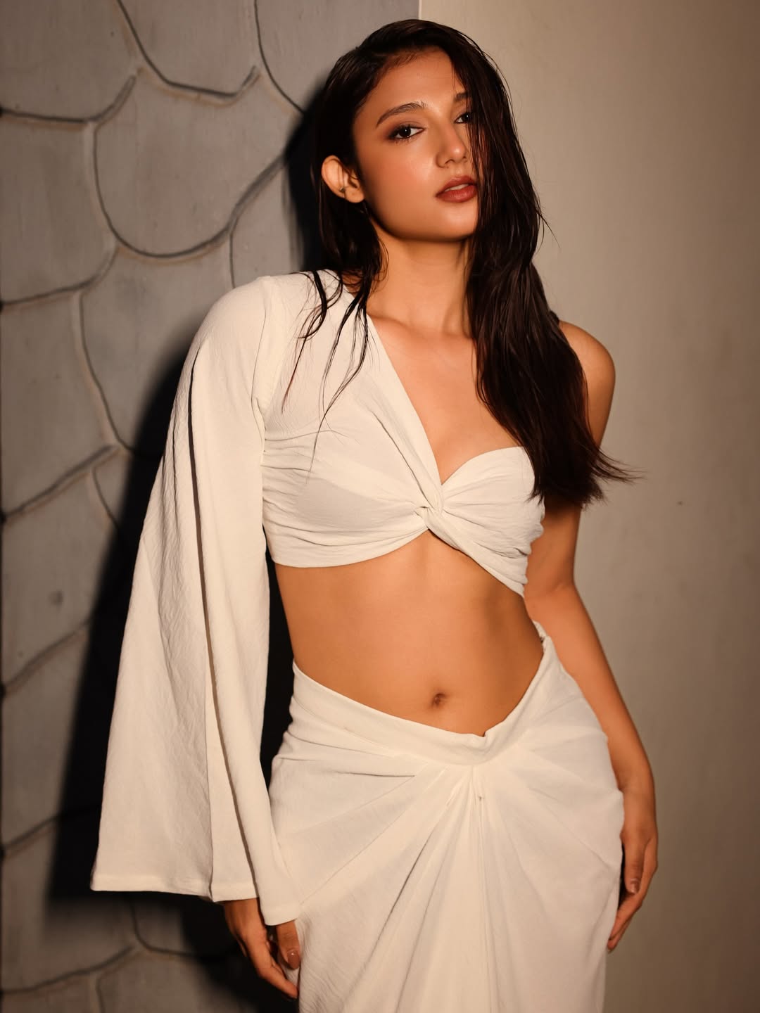 Ritika Nayak elegant all white outfit rooftop pose