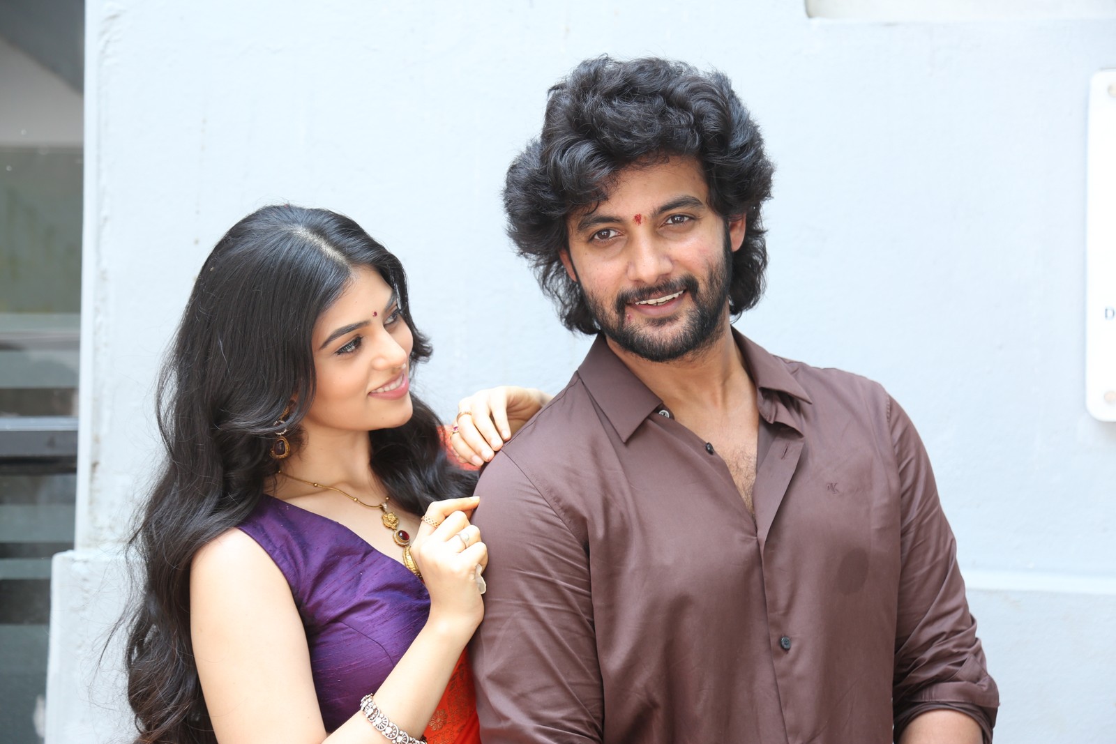 Saira Banu lead pair posing media event