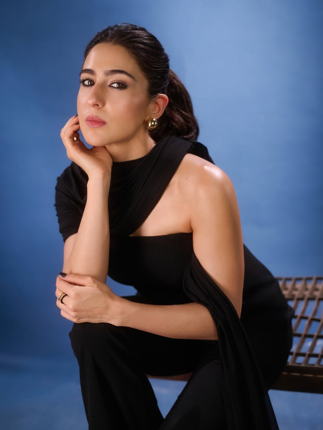 Sara Ali Khan in stylish black dress with minimal makeup and sleek hair look
