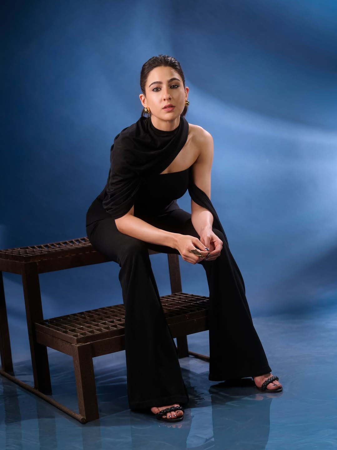 Sara Ali Khan in minimalist black outfit with statement earrings and polished look