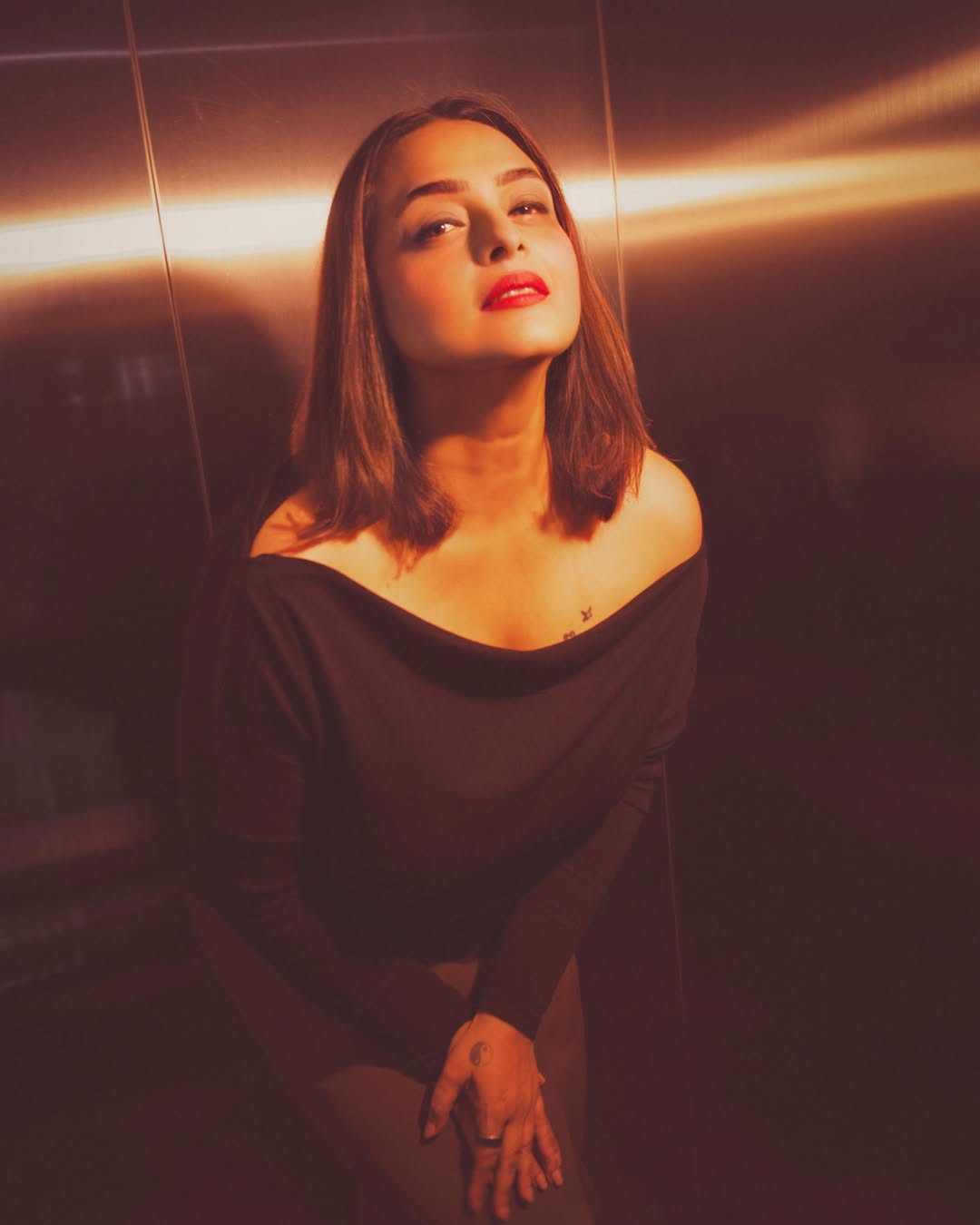 Shilpa Shirodkar wearing a stylish black outfit, posing elegantly for the camera