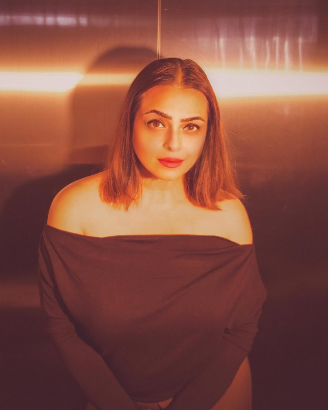 Shilpa Shirodkar in off-shoulder attire, highlighting her elegant and poised style