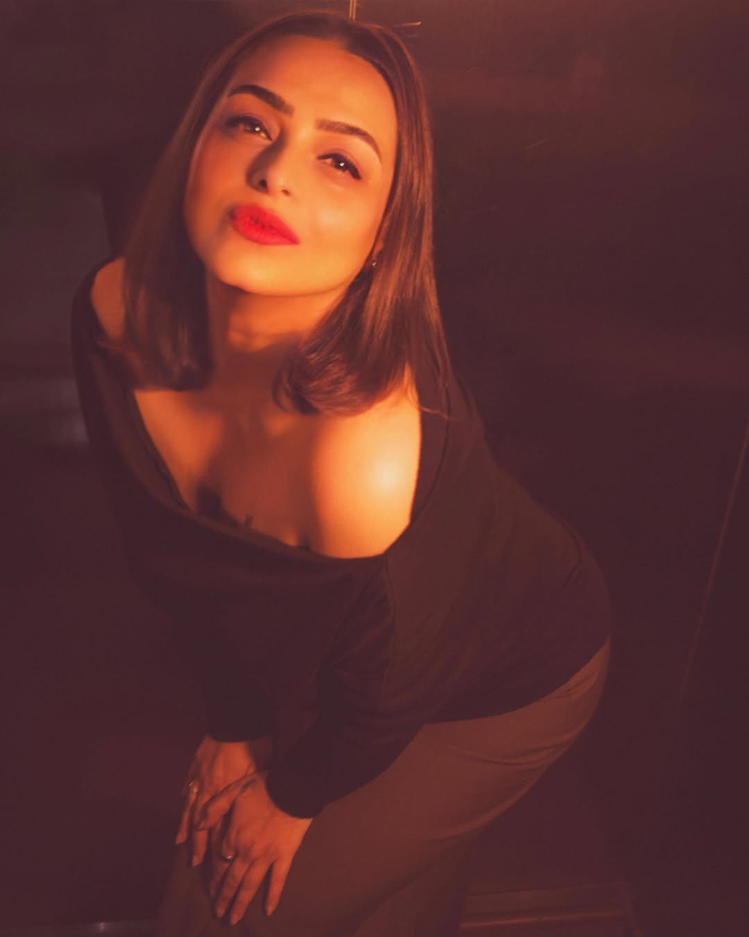 Shilpa Shirodkar in a black dress exuding confidence and modern elegance