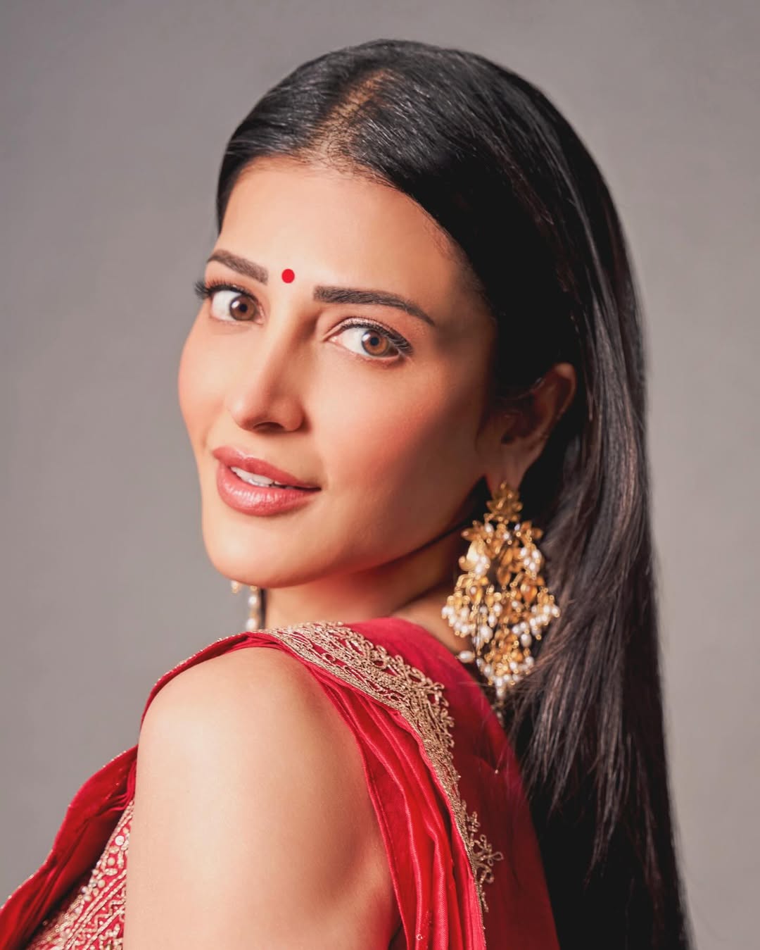 Shruti Haasan wearing a traditional outfit with poised expression and elegant styling