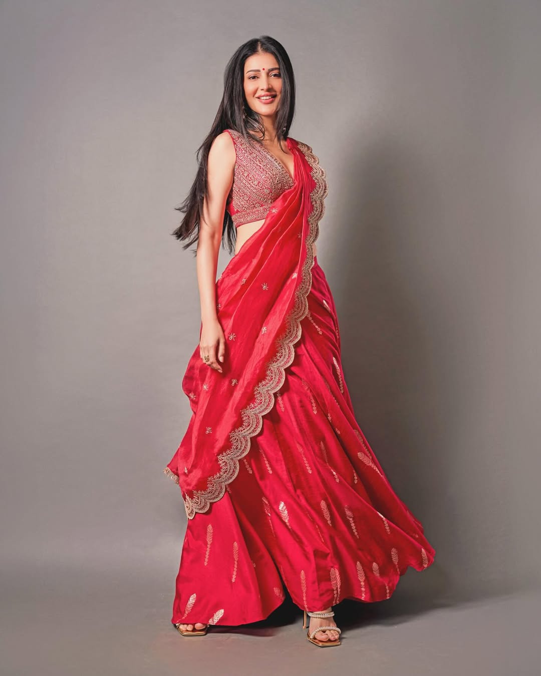 Shruti Haasan stylish red outfit confident pose modern traditional fusion look