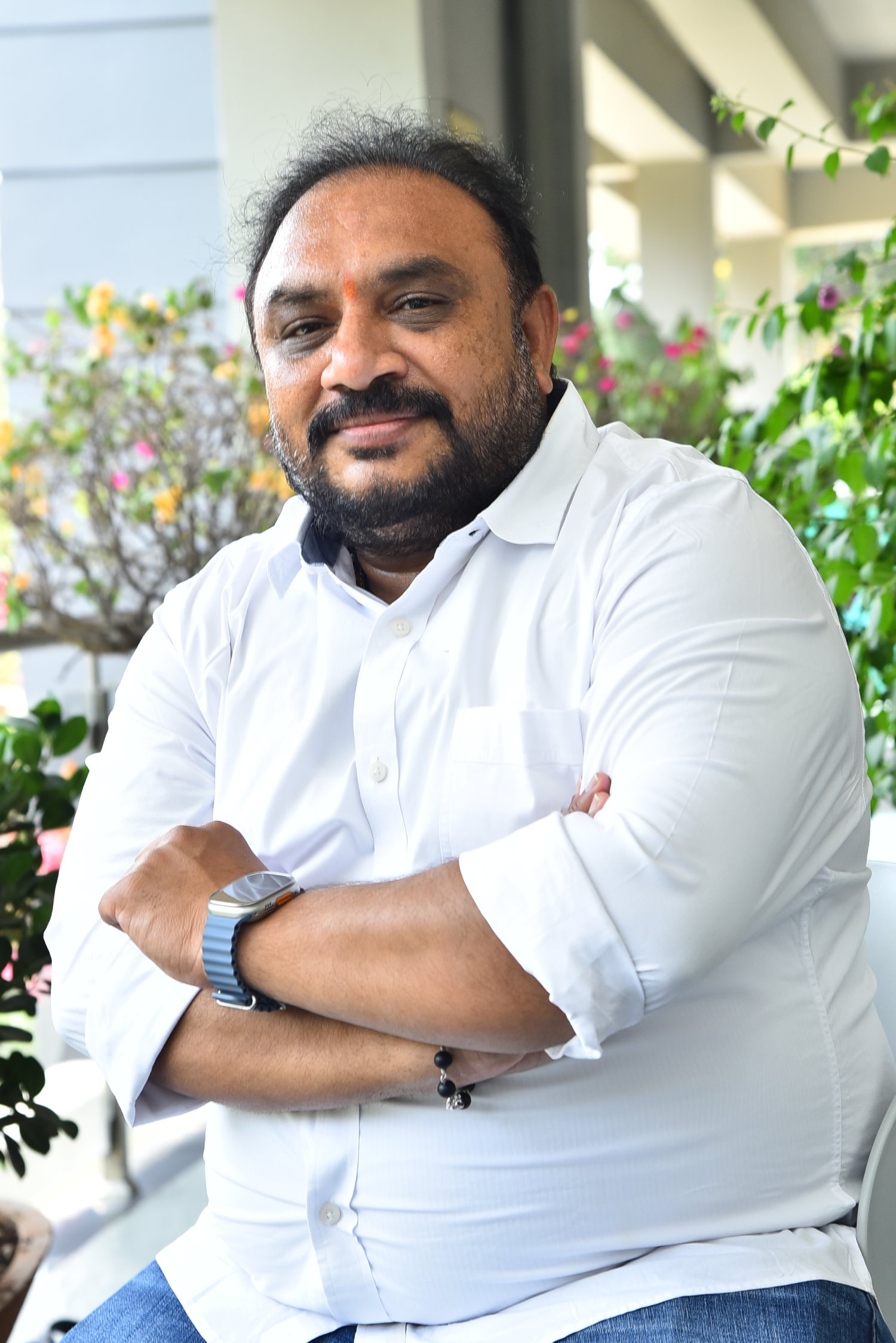 Srinivasa Rao Chinthalapudi in white shirt with confident pose