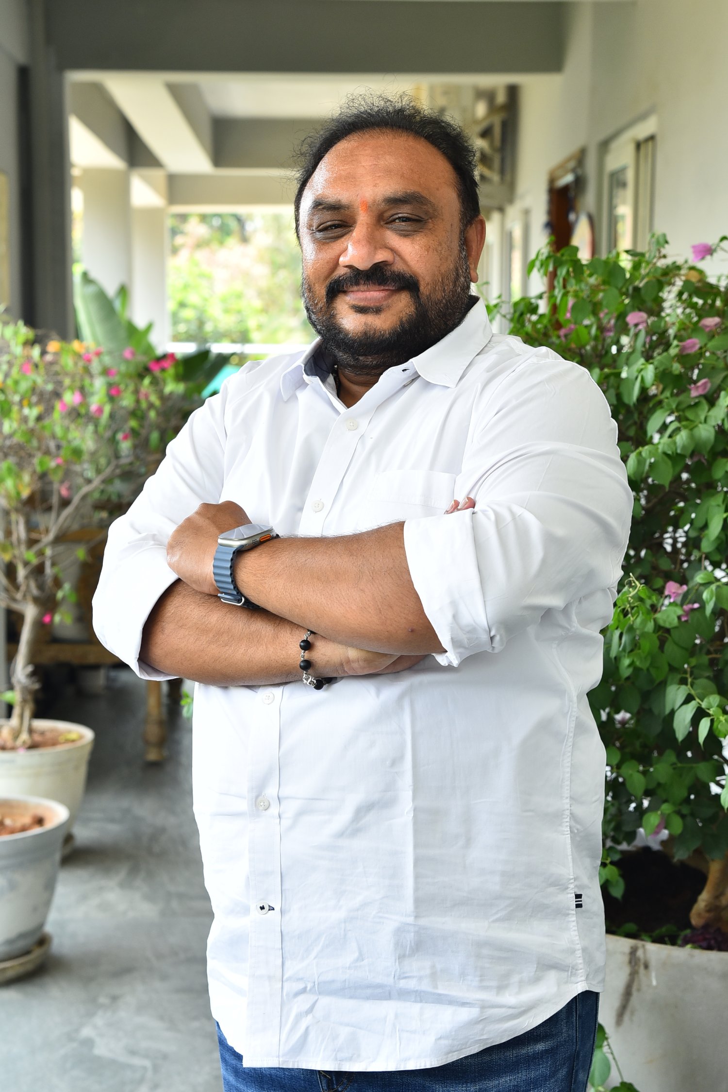 Srinivasa Rao Chinthalapudi in white shirt showcasing confident professional look