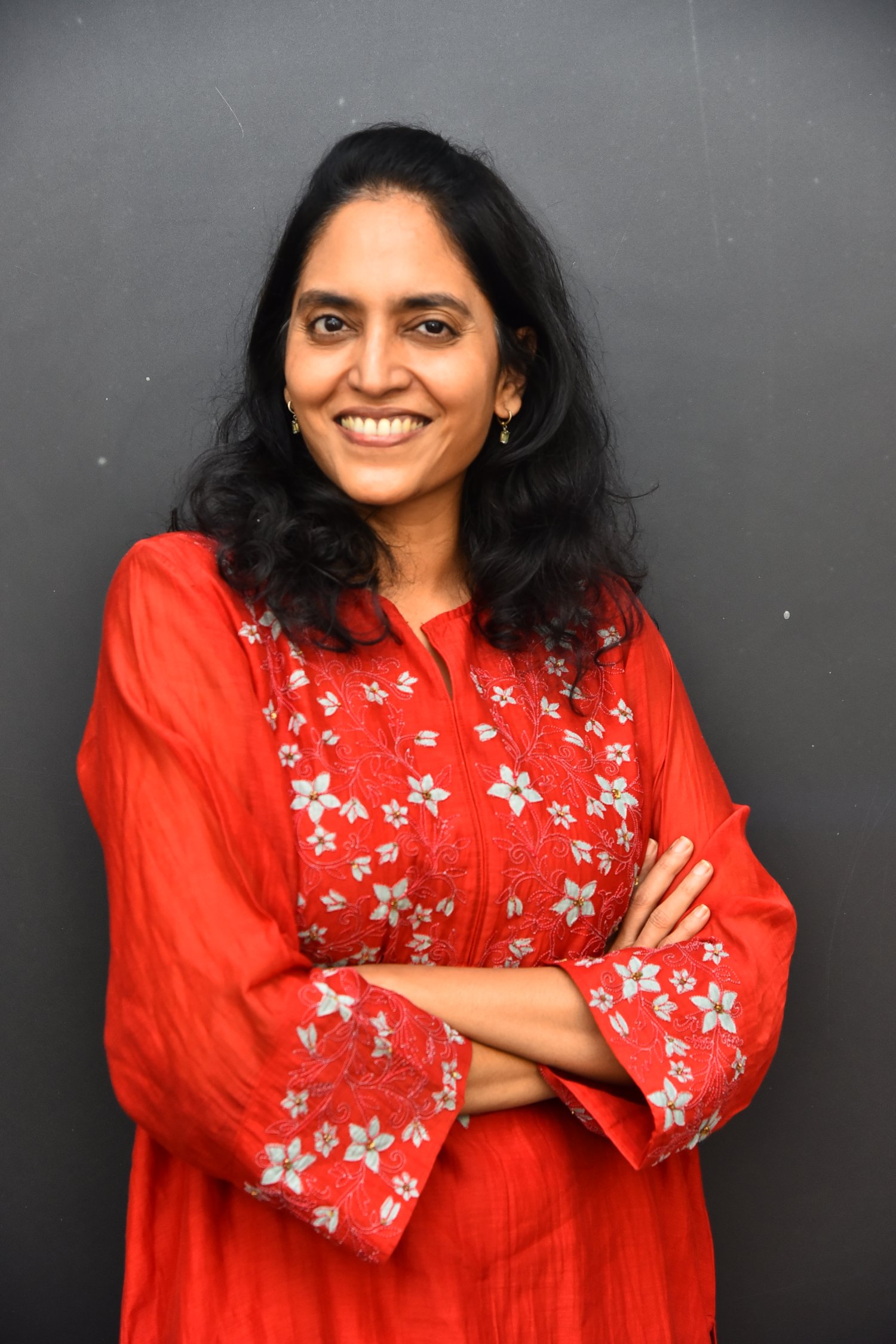 Supriya Yarlagadda in elegant red ensemble