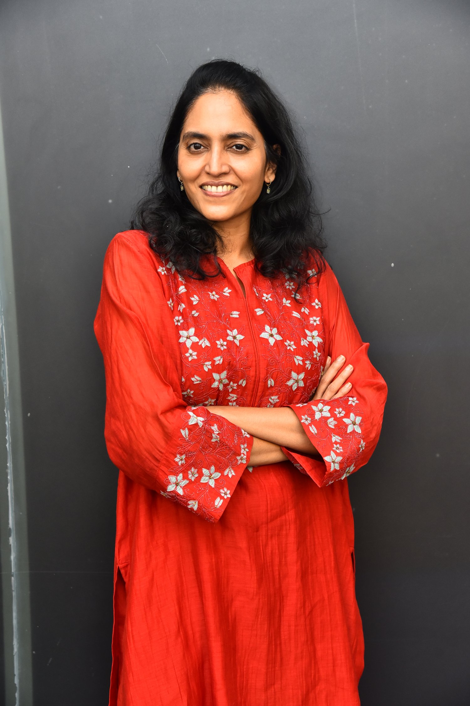 Supriya Yarlagadda vibrant red outfit stylish look