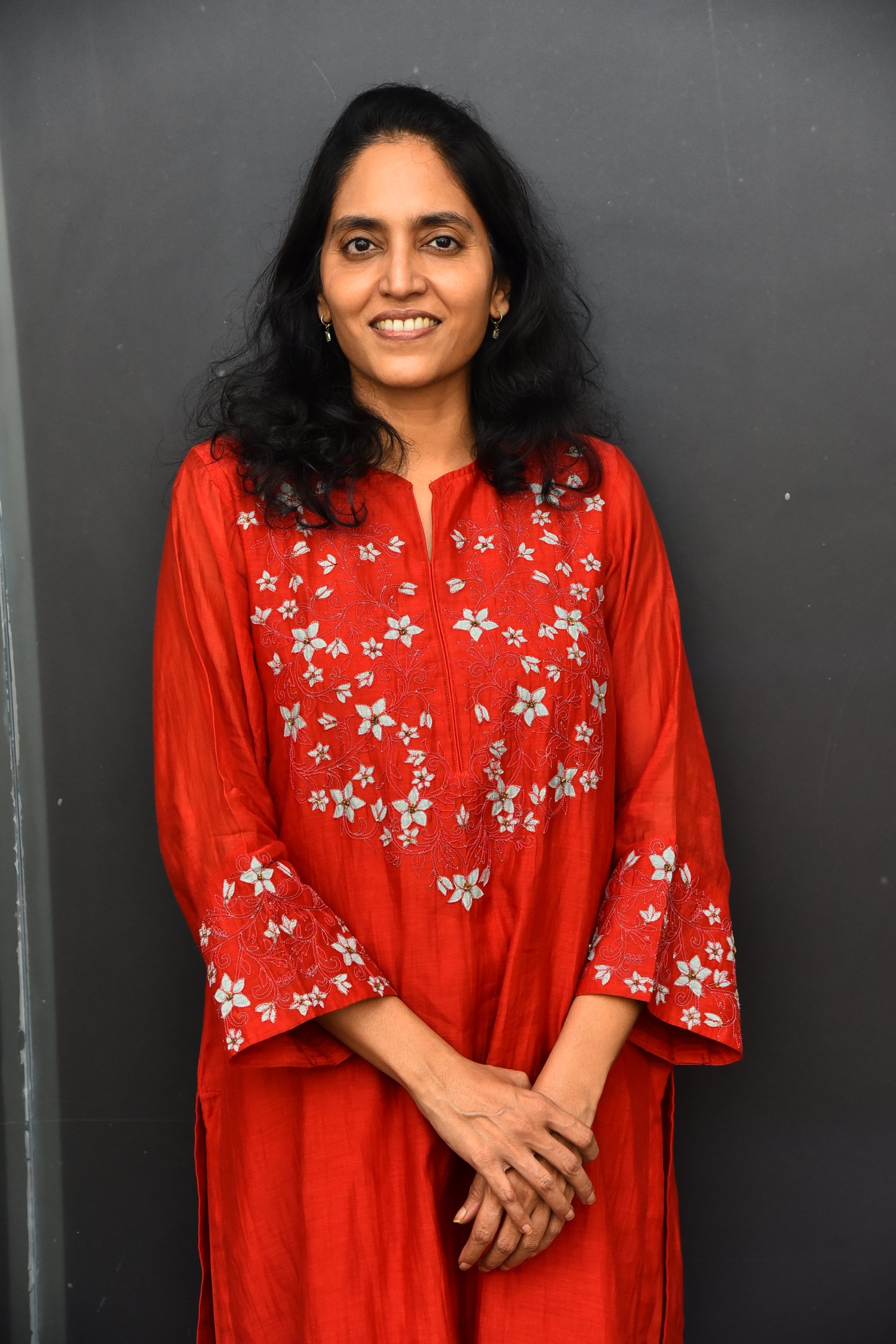 Supriya Yarlagadda red floral outfit graceful pose