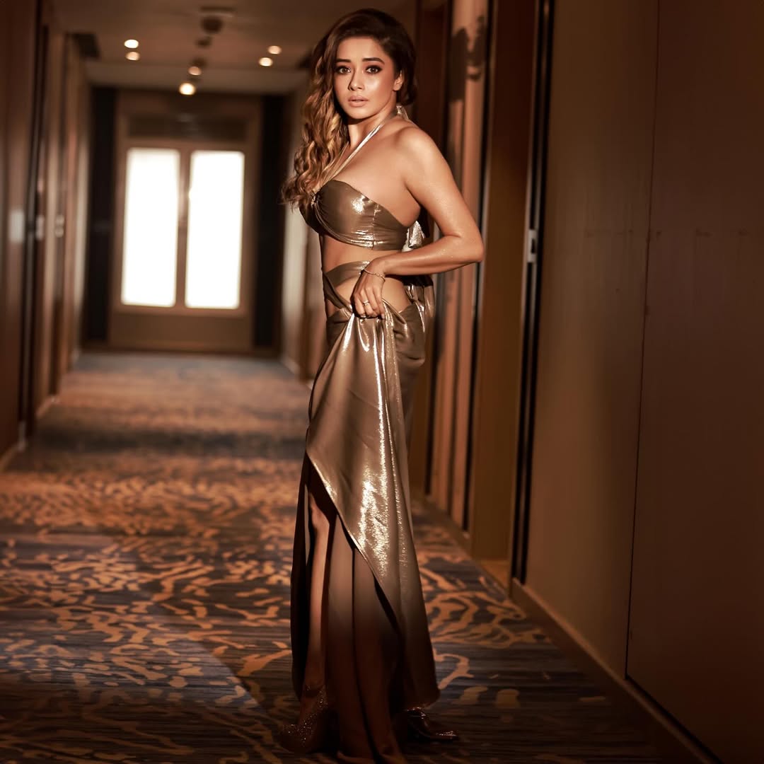 Tina Datta glowing in metallic outfit hallway fashion pose