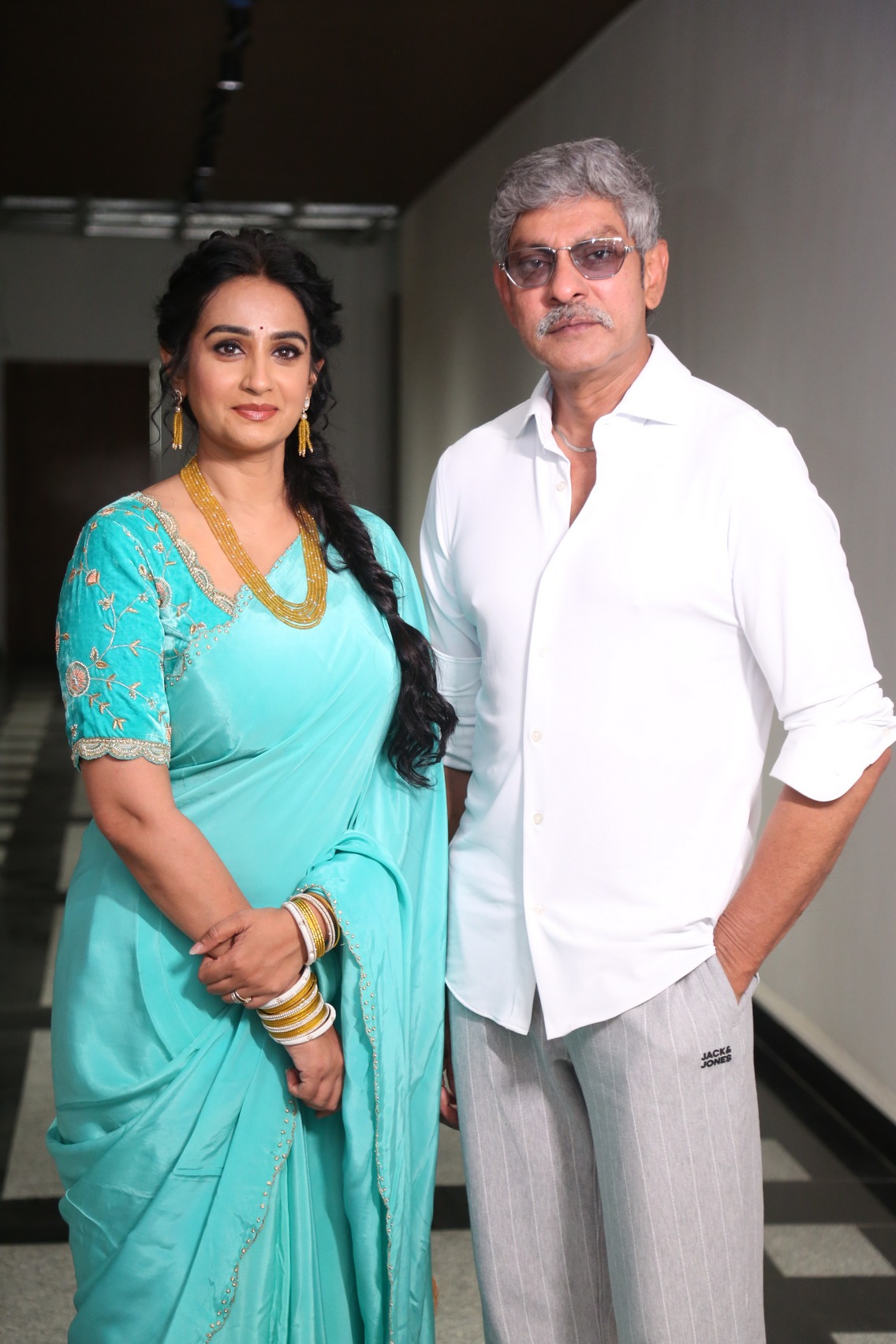 Laya and Jagapathi Babu posing together at Vadhala teaser launch event